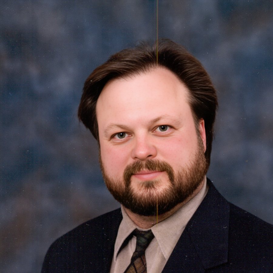 Archival studio portrait of Ken Leonard