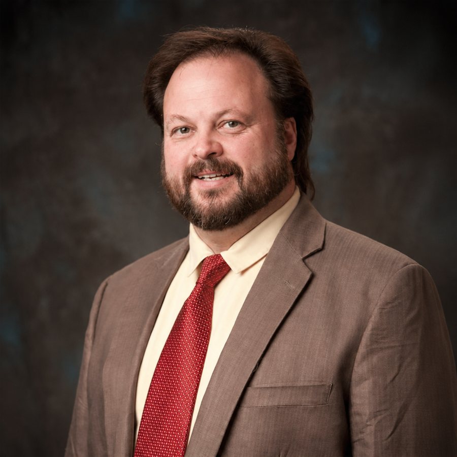 Professional portrait of Ken Leonard