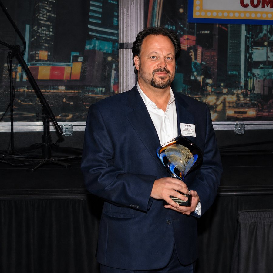 Ken Leonard accepting a business recognition award