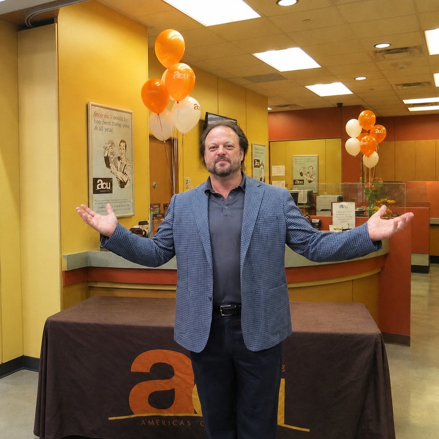 Ken Leonard welcoming members with open arms at an America's Credit Union branch celebration
