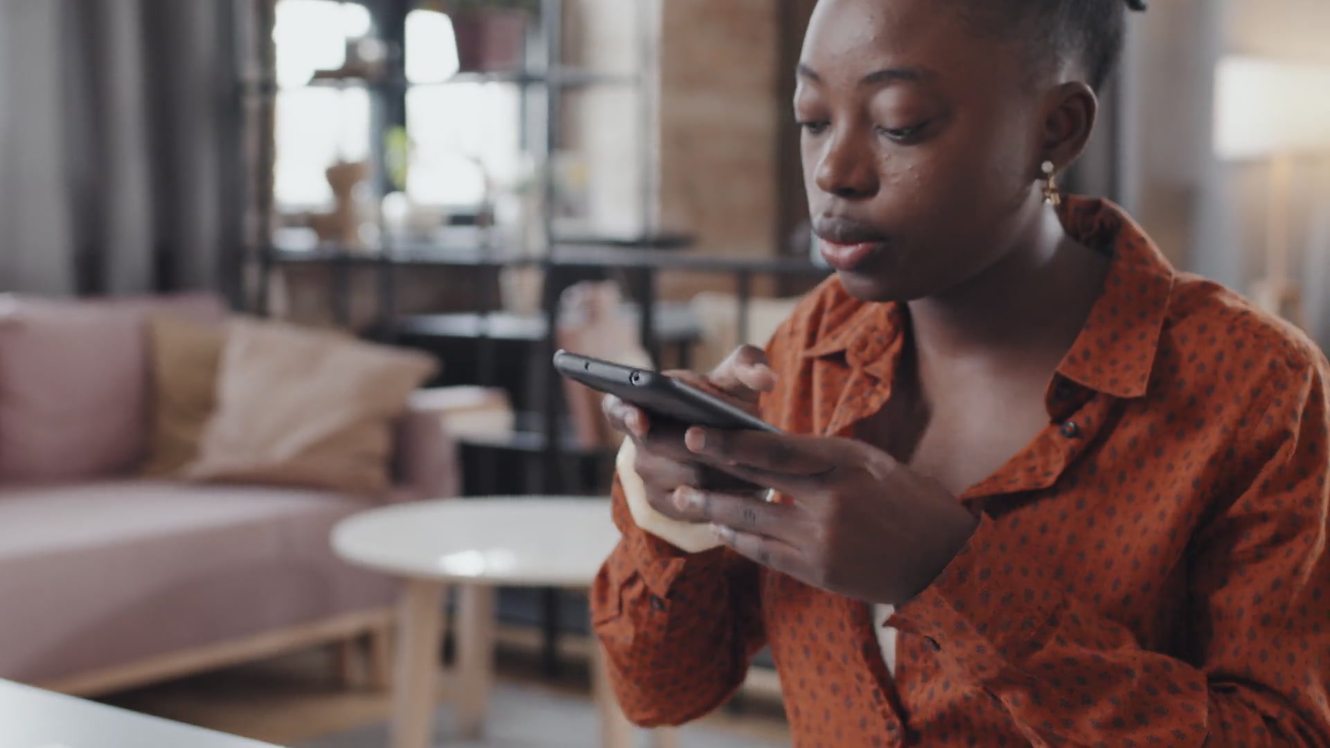 Member reviewing her credit score and finances on her phone