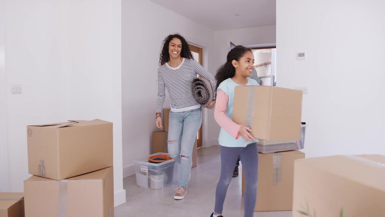 Family with two children moving into their new home