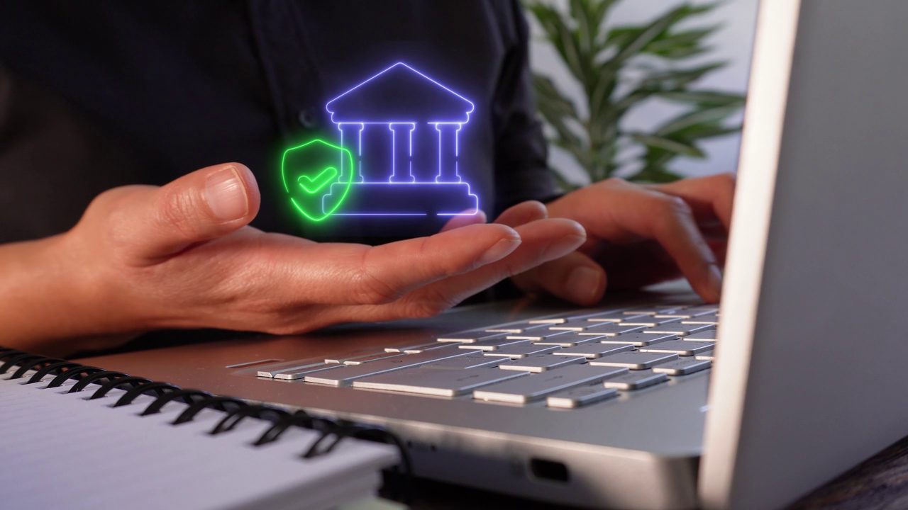 Hands working securely on a laptop