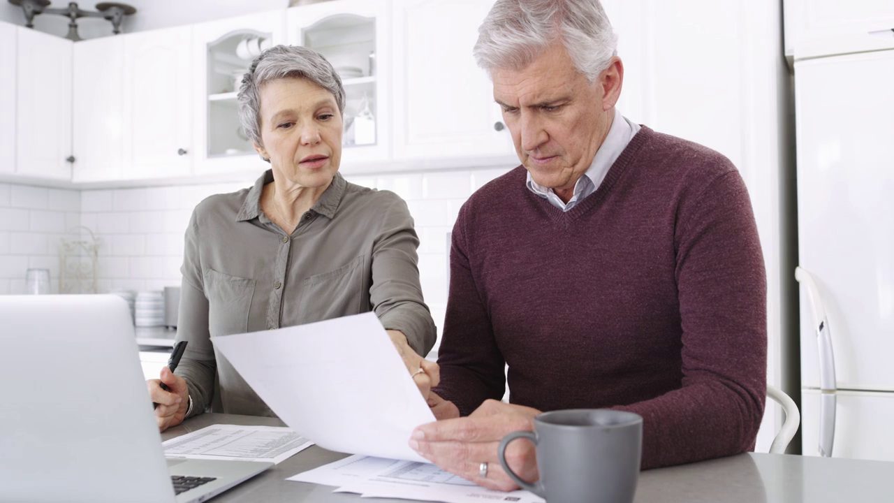 Couple working through their finances together