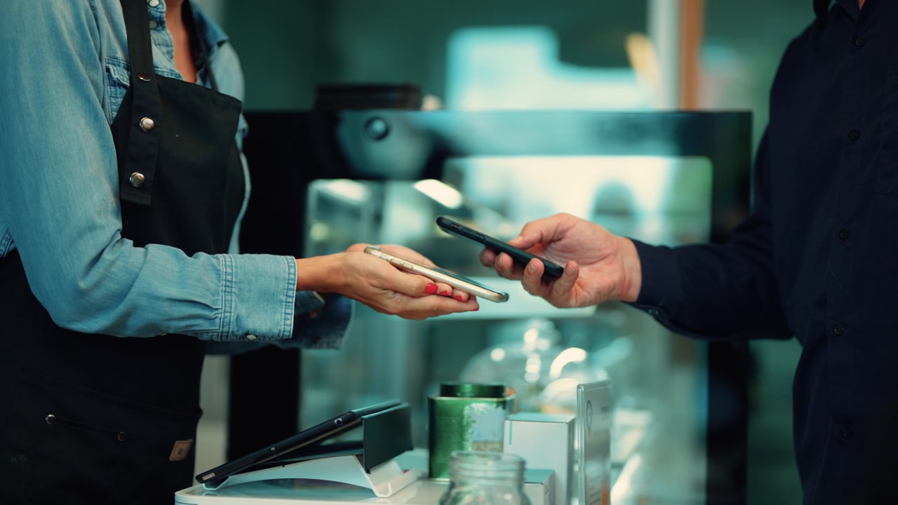 Member using a digital wallet app on a smartphone