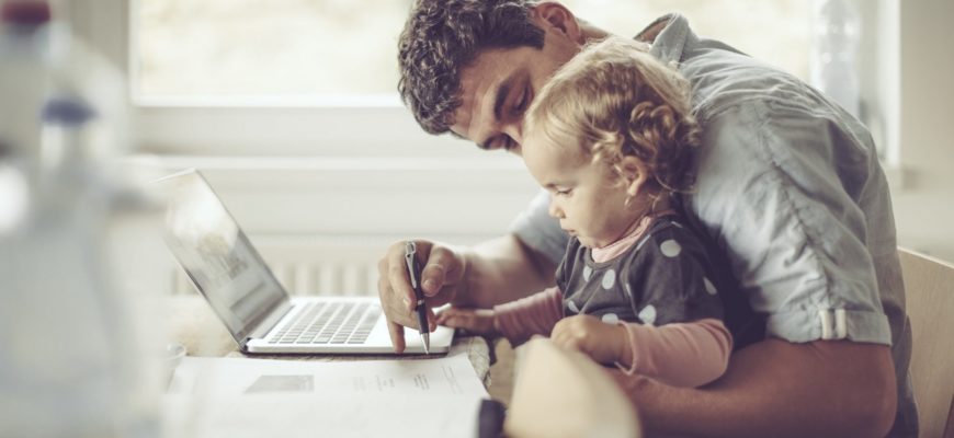 father and daughter on laptop