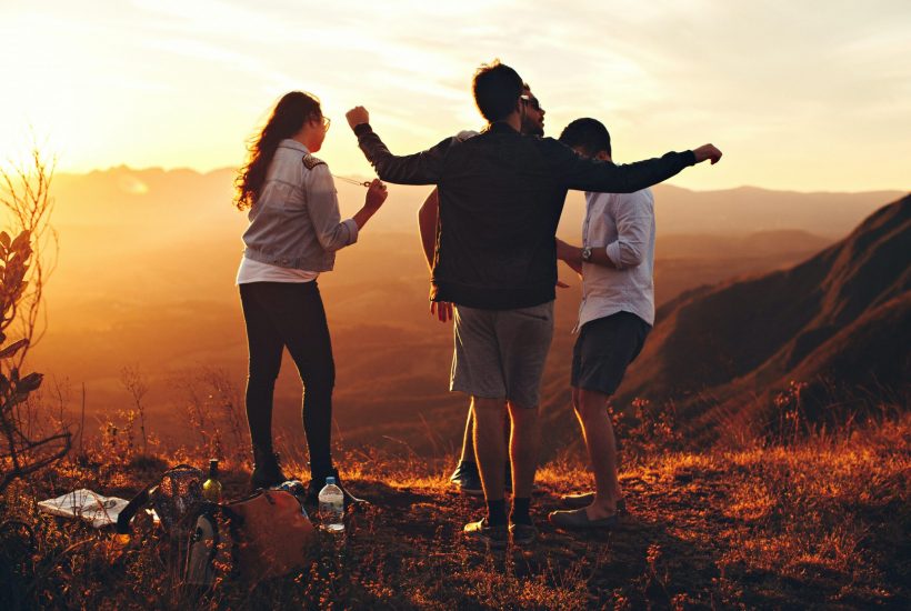 4 friends on a mountain top