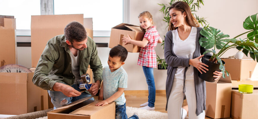 A young family unpacks their belongings after completing a military DITY move.