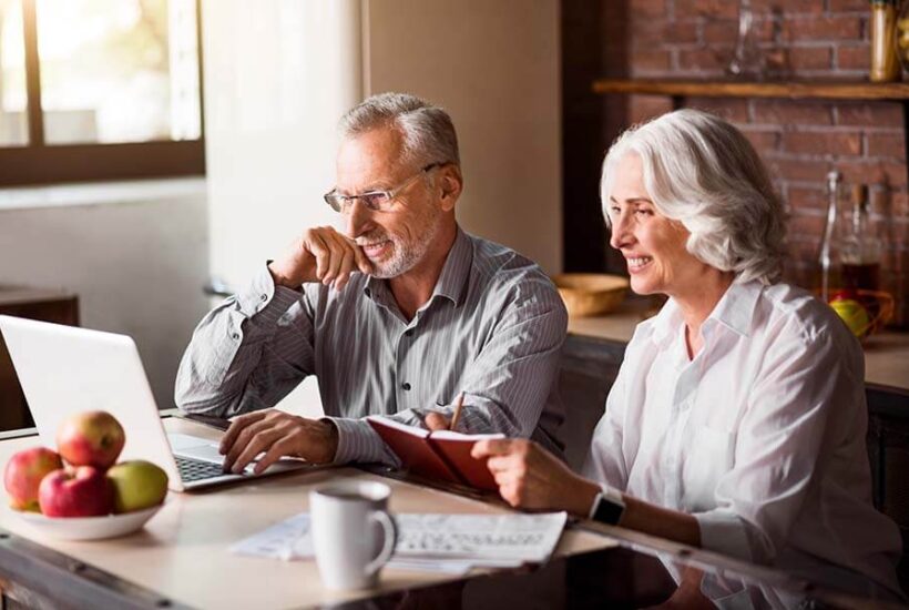 an older couple enjoys the benefits and ease of a no monthly fee checking account.