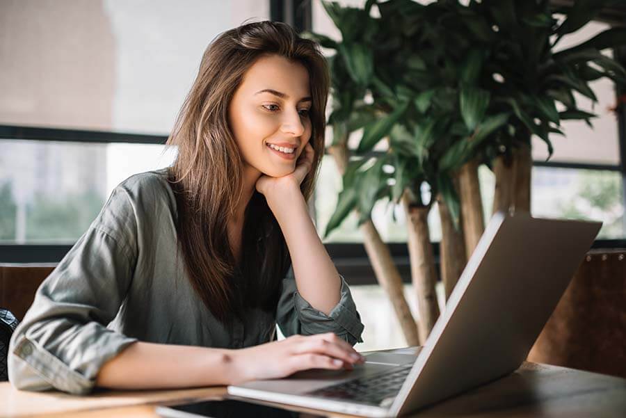 A woman checks her savings account balance online.